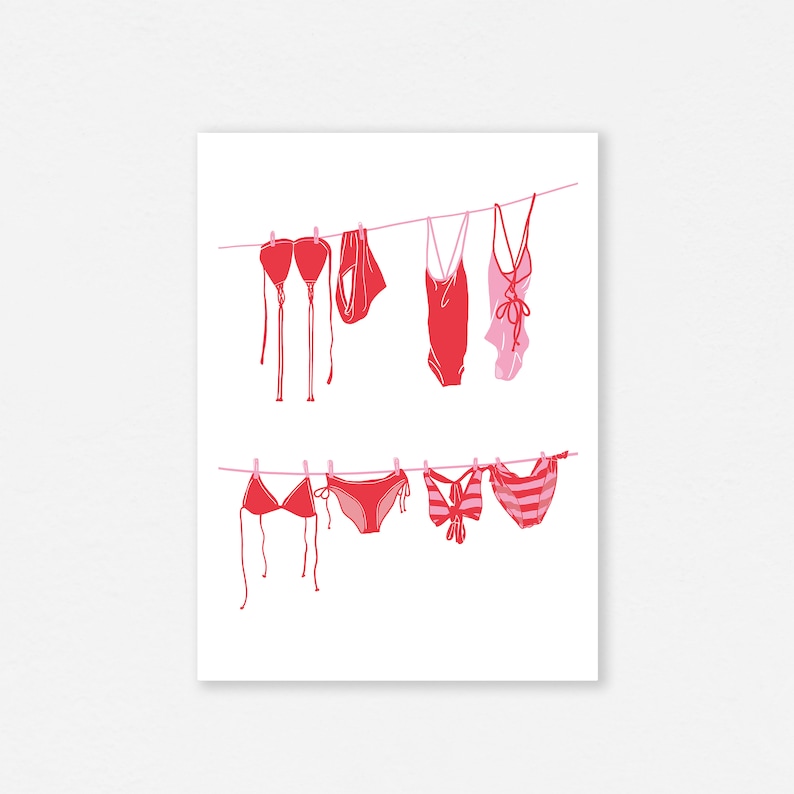 May include: A print featuring red and pink swimwear hanging on clotheslines. The image includes various styles of bikinis and one-piece swimsuits, all in a minimalist, line-art style against a white background.