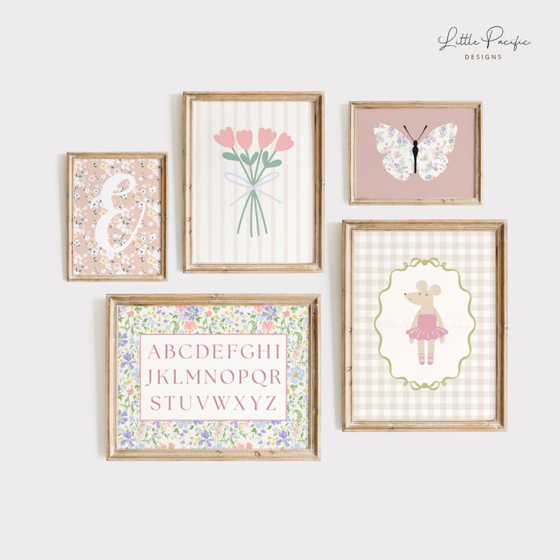 May include: A collection of framed art prints with a floral and pastel theme. The prints include a floral initial, a bouquet of pink tulips, a butterfly, a mouse ballerina, and an alphabet chart. The frames are wooden.