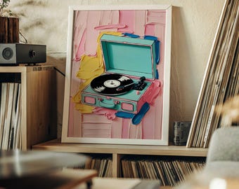 May include: A framed print of a vintage-style record player with a teal case and a black vinyl record. The background is a pink, yellow, and blue abstract painting.