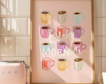 May include: A framed print featuring colorful coffee mugs in shades of pink, yellow, blue, and purple, arranged in rows. The words "Every Morning" are written in white script across the image. A pink toaster is in the foreground.