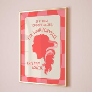 May include: A pink and white motivational poster with a silhouette of a woman with a ponytail. The text reads "If at first you don't succeed, fix your ponytail and try again."