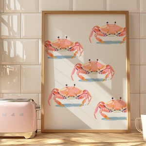 May include: A framed print with a white background and five pink crabs. The crabs are arranged in a vertical line, with the top crab at the top of the frame and the bottom crab at the bottom of the frame.