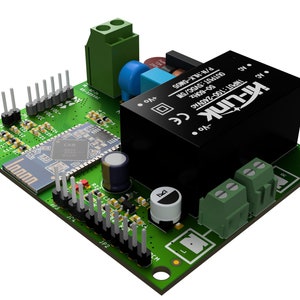 May include: A green circuit board with a black power supply unit, a blue capacitor, and a small black button. The board has a black and white Bluetooth module with the word "Inno" printed on it. The power supply unit has the text "Hi-Link INPUT:100-240VAC CE 50-60Hz OUTPUT: 5VDC/5 P/N:HLX-5M05 20."