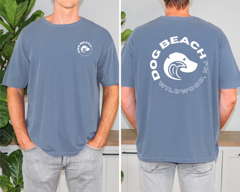 May include: A blue t-shirt with a white graphic on the back that says "Dog Beach Wildwood, NJ".