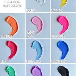 May include: A grid of colorful frosting swatches, including white, yellow, orange, light pink, hot pink, red, light blue, dark blue, green, purple, and black. Text reads "Customize your crappy cake from these base colors:"