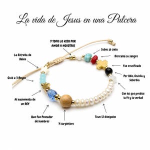 May include: A beaded bracelet featuring a variety of charms and beads including a wooden sphere, a blue crystal, a gold cross, and white pearls. The bracelet includes text labels in Spanish describing the symbolism of each bead and charm.