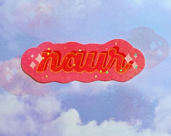 May include: A pink sticker with the word "naur" written in a retro font with orange outlines. The sticker has a wavy border and is decorated with small, glittery stars.
