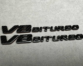 AMG V8-biturbo-embleem metaalzwart en carbon – voor Mercedes-Benz