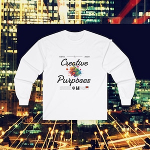 May include: White long-sleeve t-shirt with a colorful paint splatter design and the text "ESTD 2020 Creative Purposes".