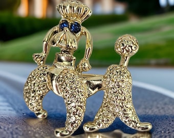 Vintage Regal Poodle Brooch Dog Lover Gift Retro Gold Tone Puppy Pin with Blue Rhinestone Eyes Poodle Prancing Puppy Midcentury Dog Brooch