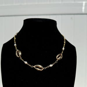 pearl + cowrie charm necklace