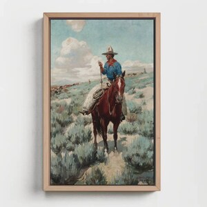 May include: A painting of a cowboy riding a brown horse through a field of sagebrush. The cowboy is wearing a blue shirt, a brown hat, and jeans. The sky is blue with white clouds.
