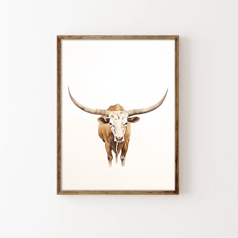 May include: A watercolour painting of a brown and white Texas Longhorn steer with large horns. The steer is facing the viewer and has a white face with brown spots.