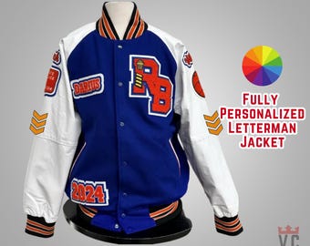 May include: A fully personalized letterman jacket in blue, white, and orange. The jacket features the text "Darius" and "2024" on patches, along with a large "RB" emblem. The sleeves are white, and the jacket has a button-up front.