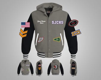 May include: A gray hooded varsity jacket with black sleeves. The jacket has a white stripe around the bottom and the sleeves. The jacket has a variety of patches, including a school logo, a football patch, and a cheerleading patch. The text "SJCHS" and "Your Name Here" are on the jacket.