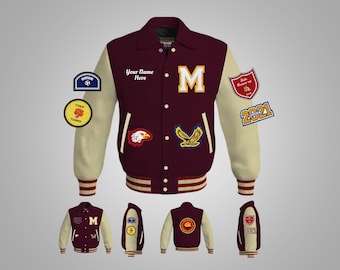 May include: Burgundy and cream varsity jacket with a large letter "M" on the front. The jacket has several patches, including a soccer ball, a tiger, a tennis racket, and an eagle. The sleeves are cream with burgundy stripes. The jacket has a white collar and a white stripe around the bottom.