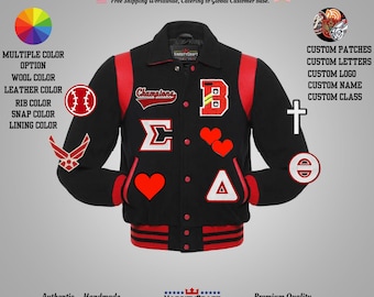 May include: Black varsity jacket with red accents, featuring patches and the word "Champions." Includes a baseball, hearts, and letter "B" patches. The jacket has a snap closure and striped ribbing.
