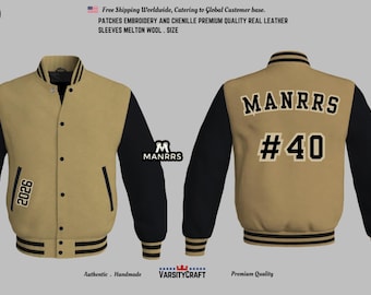 May include: A tan and black varsity jacket with the text "MANRRS #40" on the back. The front of the jacket has the number "2026" and the "BASF" logo. The jacket has black sleeves and a button-up front.