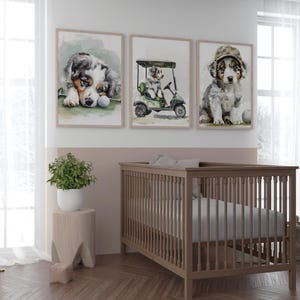 May include: Three framed watercolor prints featuring adorable puppies. One puppy rests near a golf ball, another drives a golf cart, and the third wears a golf hat. The prints have a soft, pastel color palette, perfect for a nursery or children's room.