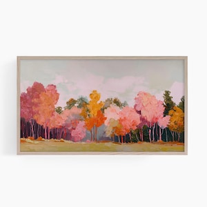 May include: A framed landscape painting depicting a vibrant forest. The artwork shows trees with pink, orange, and yellow leaves, set against a pale blue sky. The painting is in a wooden frame.