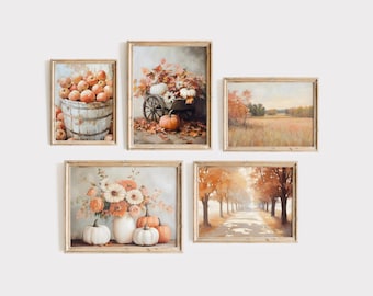 May include: Five framed autumn-themed prints with a rustic aesthetic. The prints feature pumpkins, apples, flowers, and fall foliage.