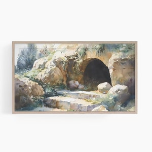 以下が含まれることがあります： 石のアーチと階段のある洞窟の入り口を描いた水彩画。洞窟は暗くて神秘的で、階段は緑の植物で覆われています。絵は明るい木製の額縁に入っています。