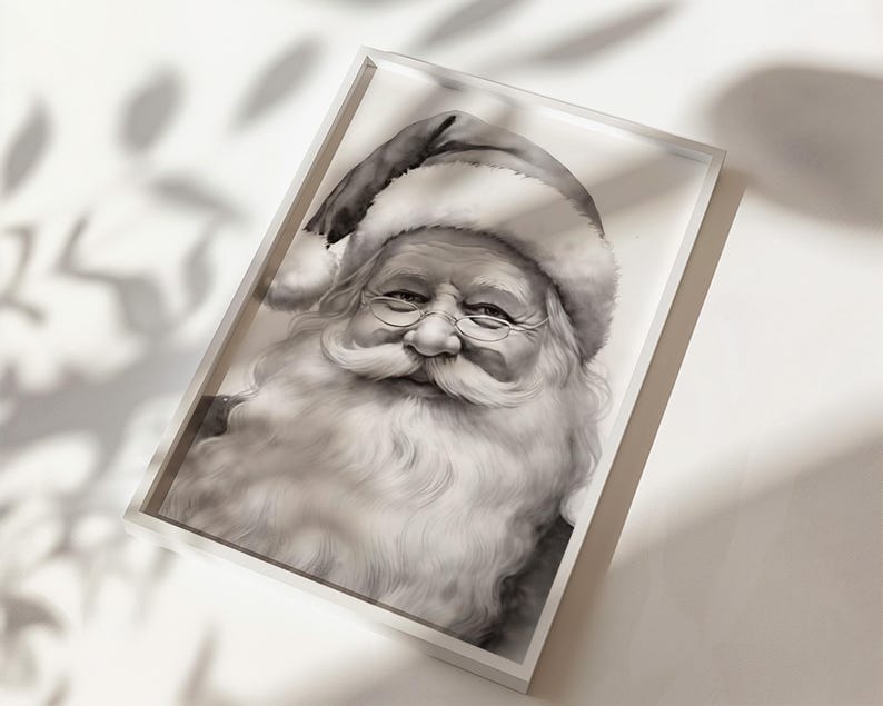 May include: Black and white framed print of Santa Claus. The portrait features Santa with a long white beard, glasses, and a traditional hat. The image is set in a white frame, creating a classic holiday decoration.