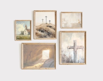 May include: A set of five framed art prints with a religious theme. The prints feature watercolor paintings of a church, crosses on a hill, and a cross with a light background. The frames are made of light-colored wood.