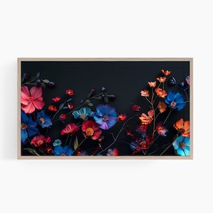 May include: A framed print of a floral arrangement with blue, red, and orange flowers on a black background.