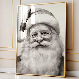 May include: Black and white framed print of Santa Claus. The portrait features Santa with a long white beard, glasses, and a traditional hat. The artwork is encased in a gold-colored frame, adding a touch of elegance to the holiday-themed decor.