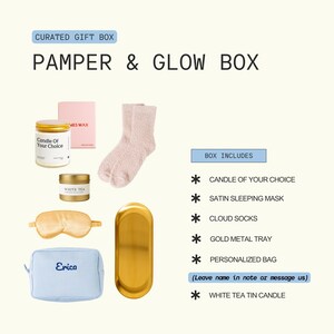 The image is a curated gift box containing various items such as a candle, a pair of socks, a pair of eye sleepers, a gold metal tray, a personalized bag, and a white tea tin candle.