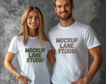 May include: Two white t-shirts with the text "Mockup Lane Studio" printed in green and brown on the front.