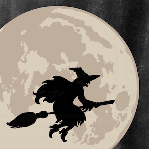 May include: A black silhouette of a witch riding a broomstick against a full moon. The moon is a light beige color with subtle texture, set against a dark gray background. The witch is wearing a pointed hat and cape.