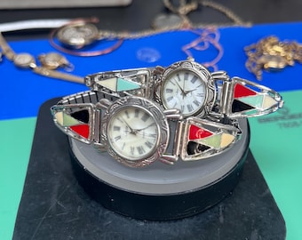 Vintage silver tone watches with colorful enamel inlay bands.