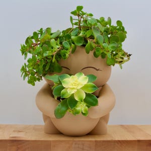 Garden Dweller, zelflozende plantenbak