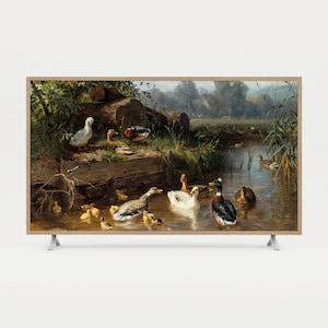 May include: A framed print of a detailed painting showing ducks and ducklings in a pond. The artwork features various duck breeds, including white and mallard ducks, in a naturalistic setting with water, vegetation, and a distant landscape.
