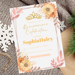 May include: A white invitation with gold and pink floral accents. The text reads "Please join us for a Quinceañera Celebration Honoring Sophia Haley 7 August, 2024 at 7:00pm 123 Anywhere St., Any City, ST 12345"