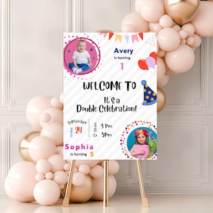May include: A white welcome sign for a double birthday celebration, with photos of two children. The sign is on a gold easel, with pink and gold balloons in the background. The text includes the date, time, and names.
