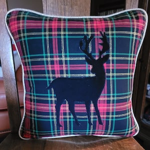 Merry Christmas.  Tartan plaid pillow. Shinny gold thread and pipping.  Deer.