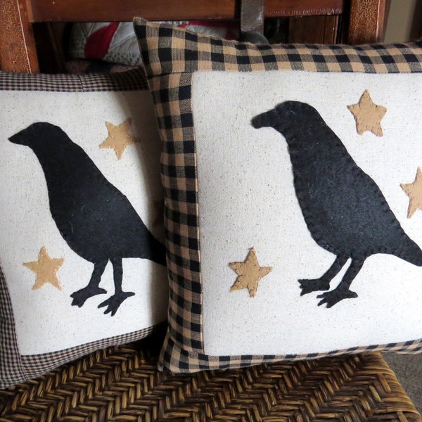 Crow and stars pillow.  Homespun fabric border and matching back.  Hand appliqued. 12" square. Farmhouse country primitive decor.