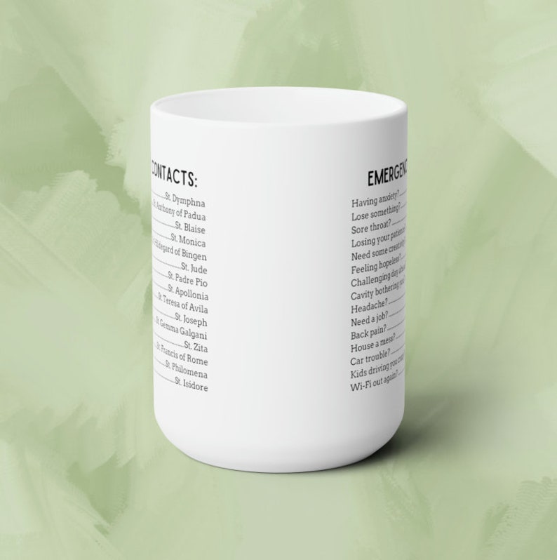 May include: White ceramic mug with black text. The left side of the mug lists a series of names under the heading "CONTACTS:". The right side of the mug lists a series of questions under the heading "EMERGENCIES".