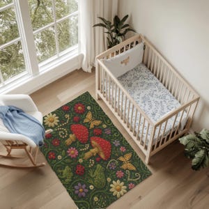 May include: A rectangular area rug featuring a dark green background with a repeating pattern of red mushrooms, yellow butterflies, green frogs, ladybugs, and various colourful flowers including daisies and purple blossoms in a textured design.