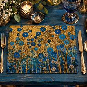 May include: A rectangular placemat featuring a vibrant floral pattern with numerous blue circular flowers and white daisy-like blossoms set against a rich, textured gold and deep blue background with intricate swirling golden vine details.