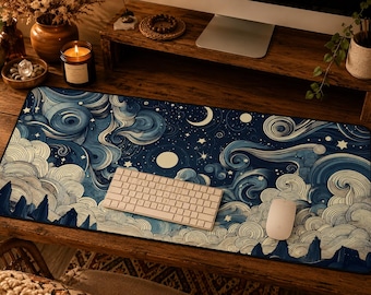 May include: A rectangular desk mat featuring a dark blue night sky illustration with swirling clouds, a crescent moon, and scattered stars. The design includes a white computer keyboard and a white computer mouse placed on top of the mat surface.
