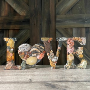 Yooper LOVE resin art with Fluorescent Sodalite stone (Yooperlite, tm.) and a variety of rocks from Lake Superior’s Upper Peninsula shores.