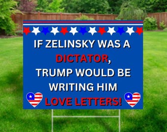 Może przedstawiać: Niebieski znak ogrodowy z białymi gwiazdami i czerwono-niebieskimi paskami na górze. Na znaku widnieje napis "IF ZELINSKY WAS A DICTATOR, TRUMP WOULD BE WRITING HIM LOVE LETTERS!" z grafiką serca.
