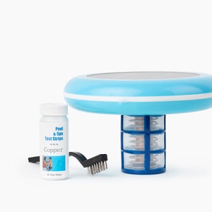 May include: A blue solar powered pool and spa fountain with a blue and white filter, a bottle of copper pool and spa test strips, and a blue cleaning brush.