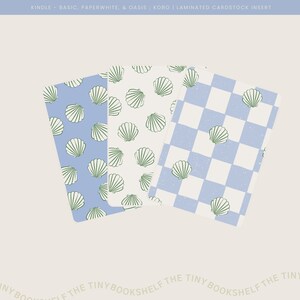 May include: Three book covers with different patterns. The first two covers feature a white background with a repeating pattern of green and white seashells on a light blue background. The third cover features a light blue and white checkered pattern.