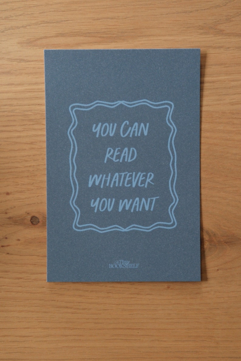May include: A blue card with the text "You can read whatever you want" in a white frame. The text "The Bookshelf" is printed in white at the bottom of the card.