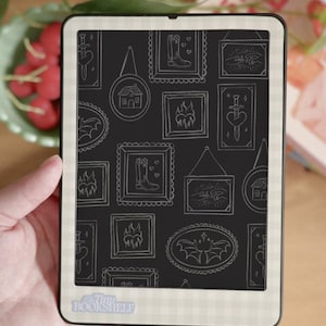 May include: A black and white e-reader with a white background and a black screen. The screen displays a pattern of white frames with various illustrations inside, including a house, a boot, a sword, a bat, and a hand. The e-reader has the text "Tiny Bookshelf" on the bottom.